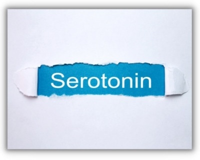 serotonin logo being revealed from behind ripped paper